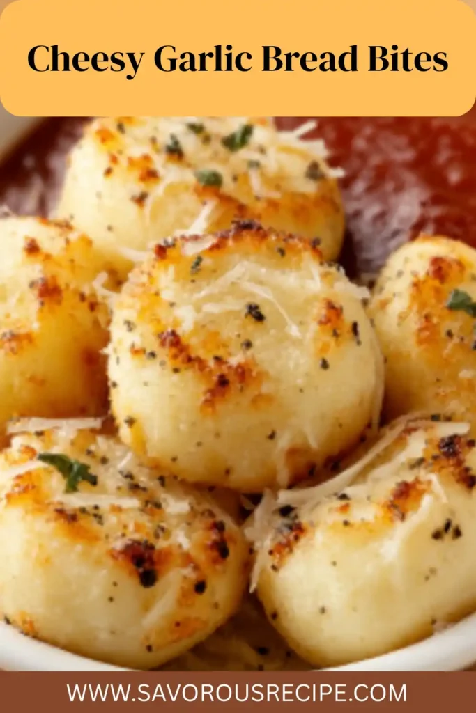 golden brown garlic bread bites with melted cheese and herbs on white plate, served with marinara sauce