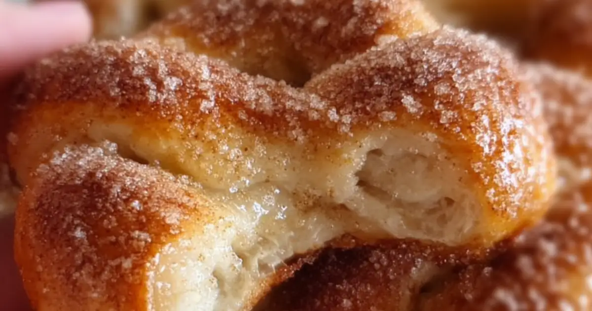 golden cinnamon sugar pastry twist with fluffy layers and sugar coating
