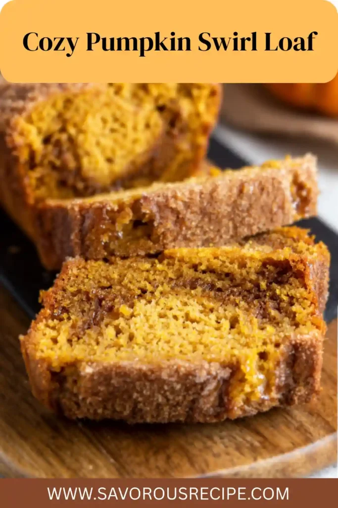 Moist pumpkin swirl loaf with cinnamon layers and crisp sugar crust on a wooden board