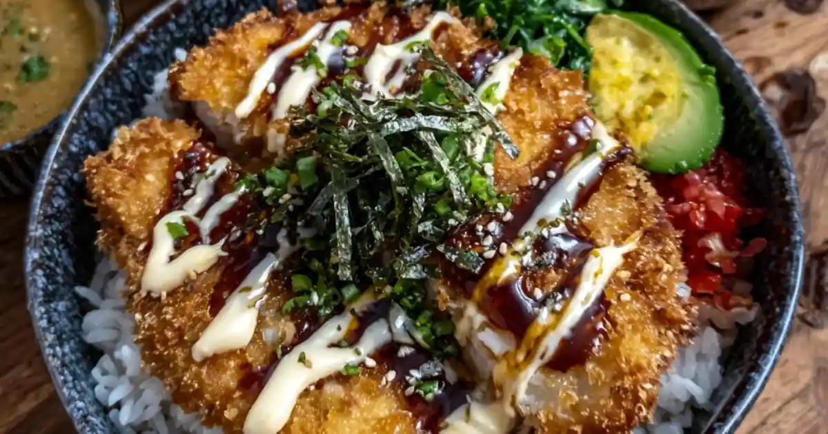 crispy chicken katsu bowl with rice, avocado, seaweed, greens, and sesame drizzle