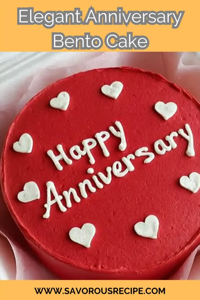Elegant red bento cake with white icing hearts and “Happy Anniversary” text in box