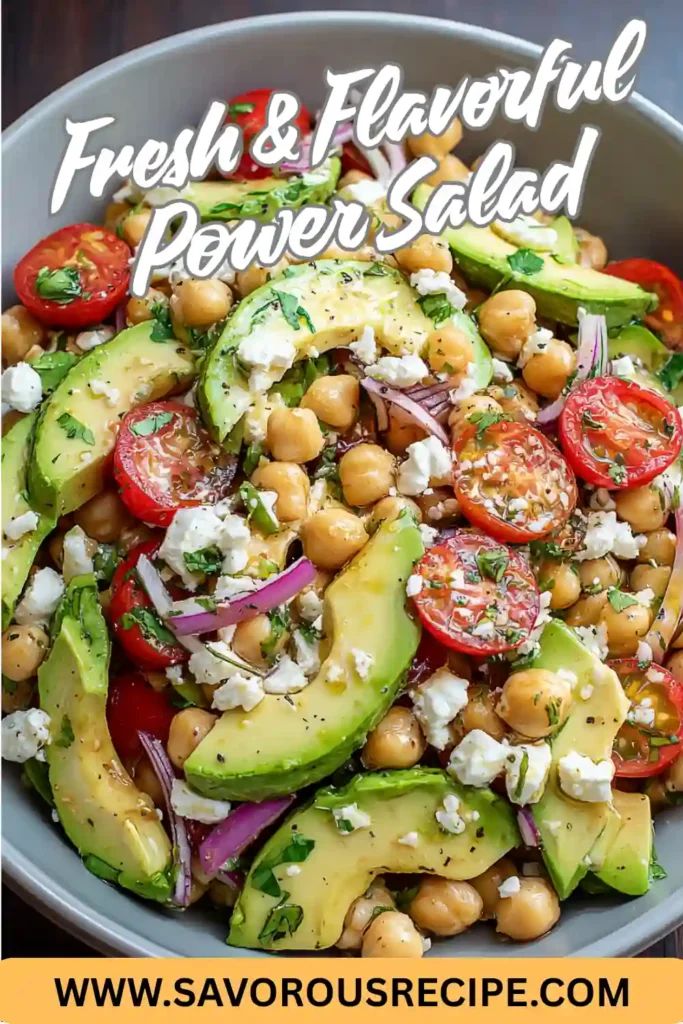 fresh avocado chickpea salad with tomatoes, feta, and herbs in a large bowl