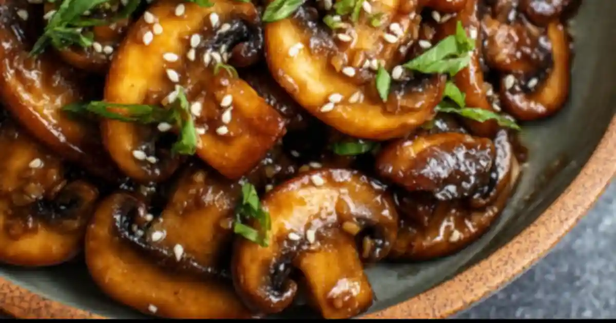 savory miso mushrooms with sesame seeds and scallions in a rustic bowl