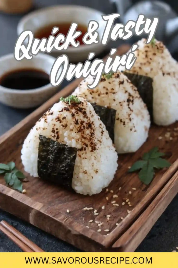 Japanese onigiri rice balls wrapped in seaweed with sesame seeds on a wooden tray