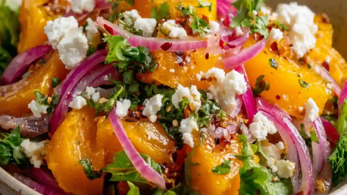 roasted butternut squash salad with crumbled feta, red onion, fresh herbs and chili flakes