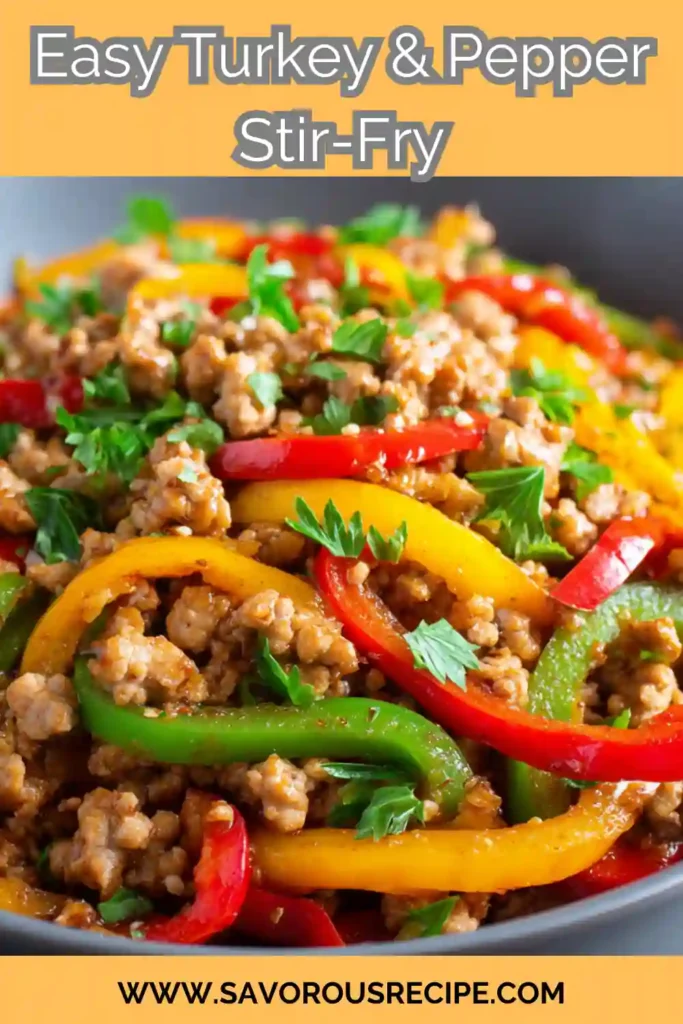 Colorful turkey stir fry with red, yellow, and green bell peppers garnished with parsley in a skillet