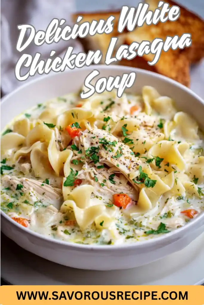 A creamy bowl of white chicken lasagna soup with bowtie pasta, shredded chicken, parmesan cheese, and herbs served with toasted bread.