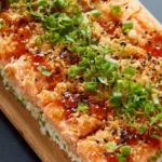 Baked Salmon Sushi Dish with Creamy Toppings and Seaweed