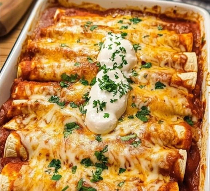 Delicious quick and easy chicken enchiladas topped with cheese and salsa