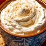 Cream Cheese Cheesecake Dip served in a bowl with fresh fruits