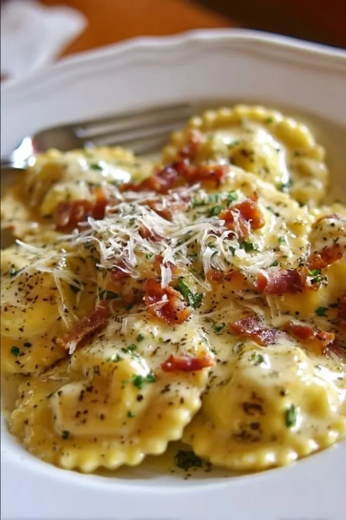 Delicious Olive Garden Ravioli Carbonara topped with creamy sauce and bacon