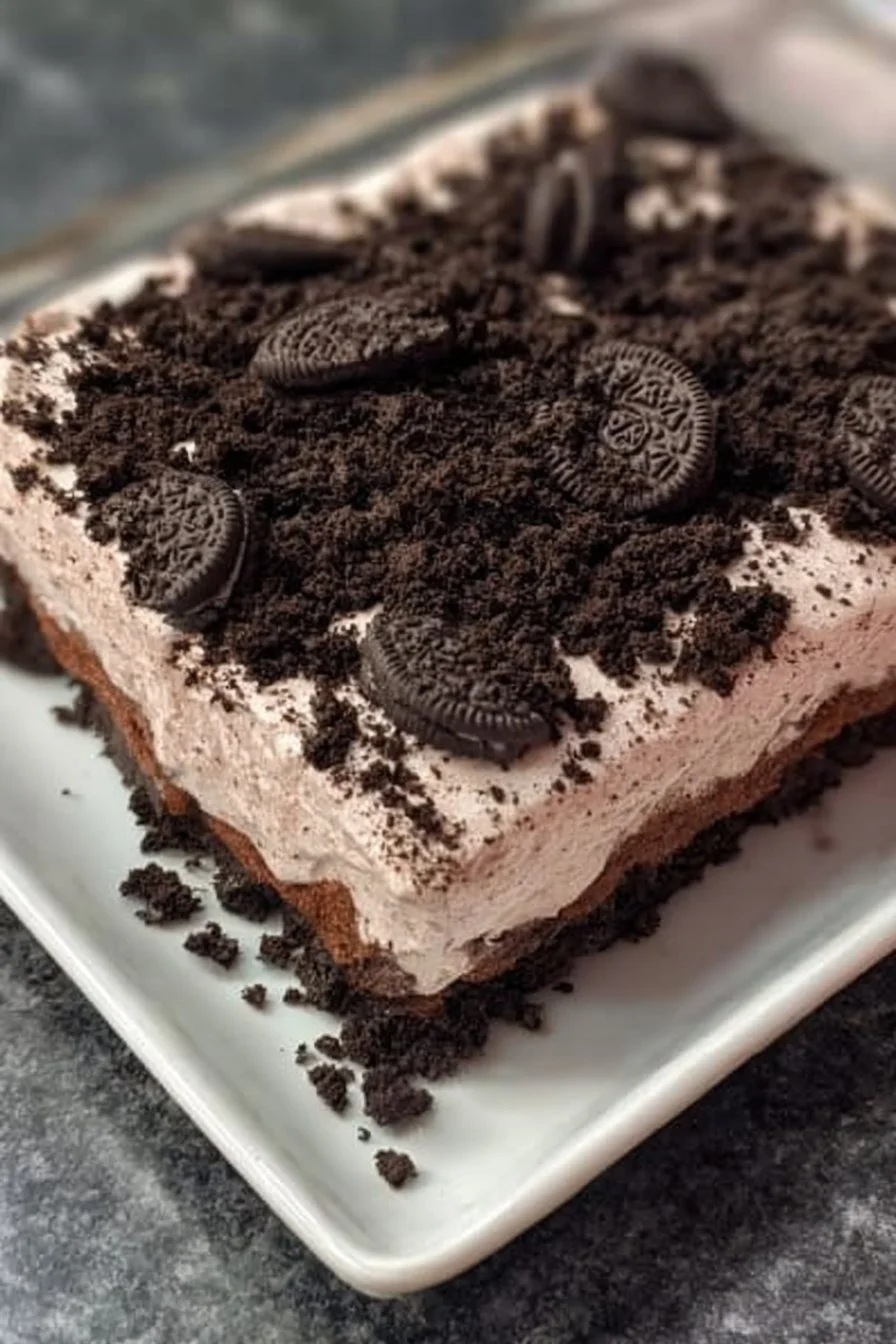 Delicious homemade Oreo Dirt Cake with layers of cream and crushed Oreos