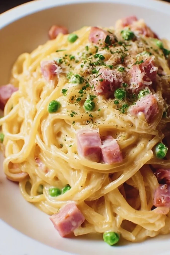 Delicious quick leftover ham carbonara dish topped with parsley