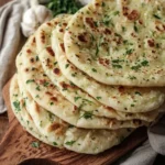 Homemade garlic flatbread sliced and ready to serve, no yeast required.