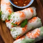 Fresh spring rolls with colorful vegetables and a tasty dipping sauce