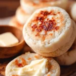 Homemade English muffins baked to perfection, ready for breakfast.