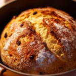 Freshly baked No-Knead Dutch Oven Bread with a crispy crust.
