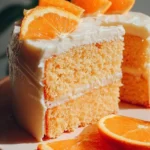Deliciously decorated Orange Creamsicle Cake with orange and cream frosting.