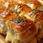 Cuban sliders with pickle-garlic butter on a wooden tray