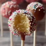 Delicious cake pops served on a colorful plate, showcasing various flavors and toppings.