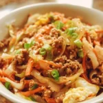 Delicious Chicken Egg Roll in a Bowl garnished with fresh vegetables