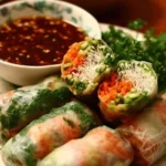 Plate of delicious Thai Spring Rolls served with dipping sauce