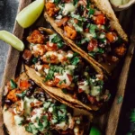 Colorful easy vegetarian tacos filled with fresh vegetables and toppings.