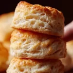 Freshly baked homemade biscuits served with butter and jam