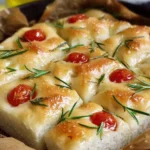 Delicious Mini No-Knead Focaccia bread topped with herbs and olive oil.