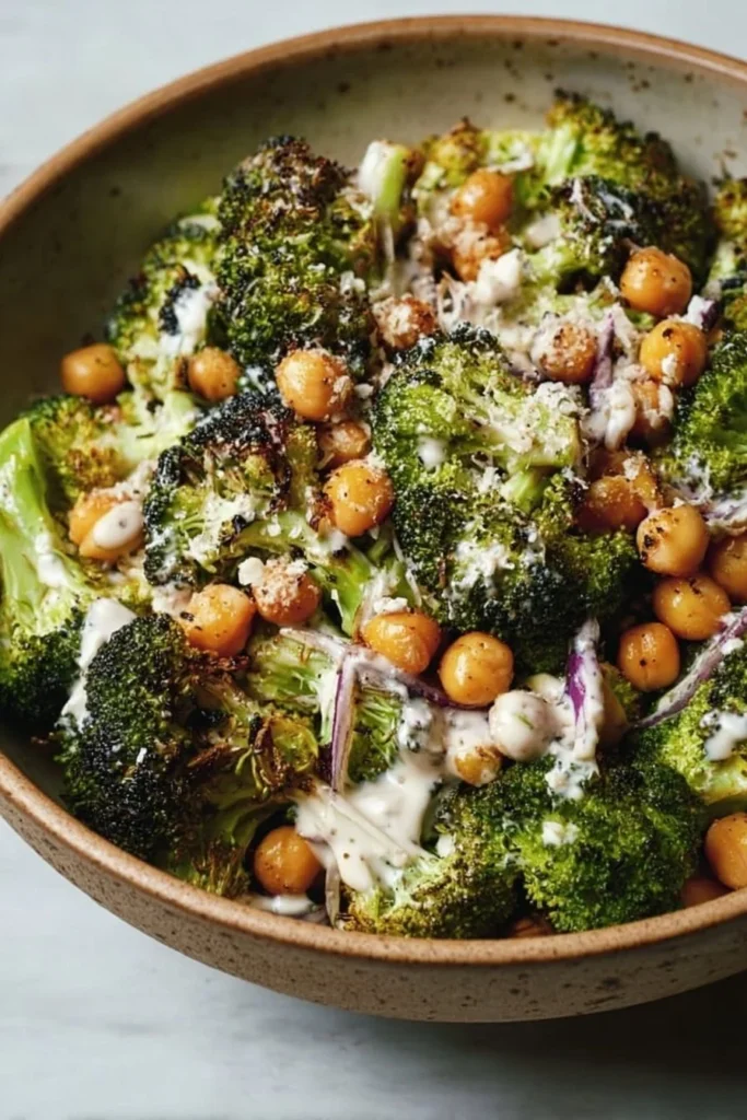 Roasted broccoli and chickpea salad drizzled with tahini-Parmesan dressing