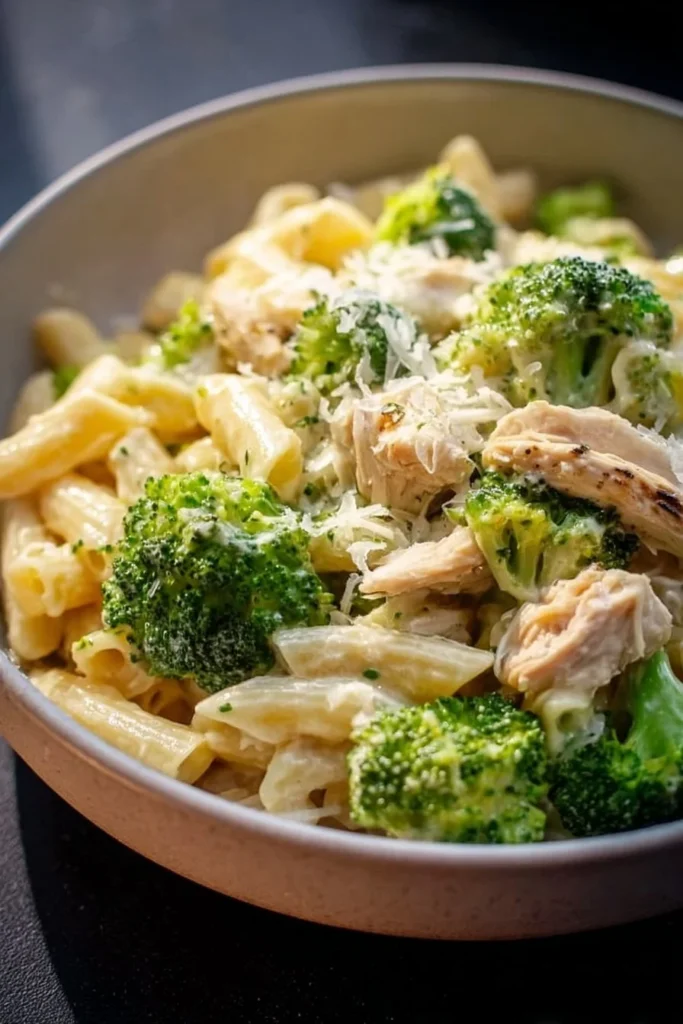 Rotisserie chicken broccoli pasta dish with vibrant vegetables