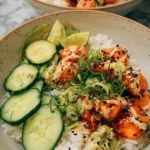 Spicy Salmon Bowl with Coconut Rice garnished with vegetables