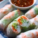 Fresh Vietnamese spring rolls filled with herbs, vegetables, and shrimp.