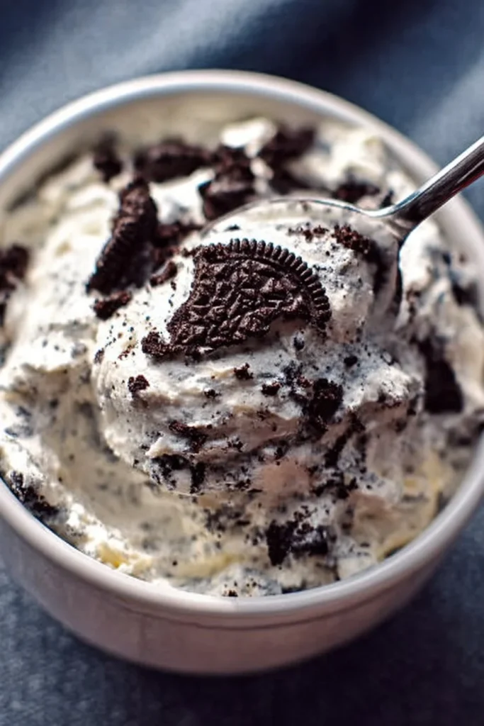 Weight Watcher Friendly Oreo Fluff dessert in a bowl topped with crushed Oreos.
