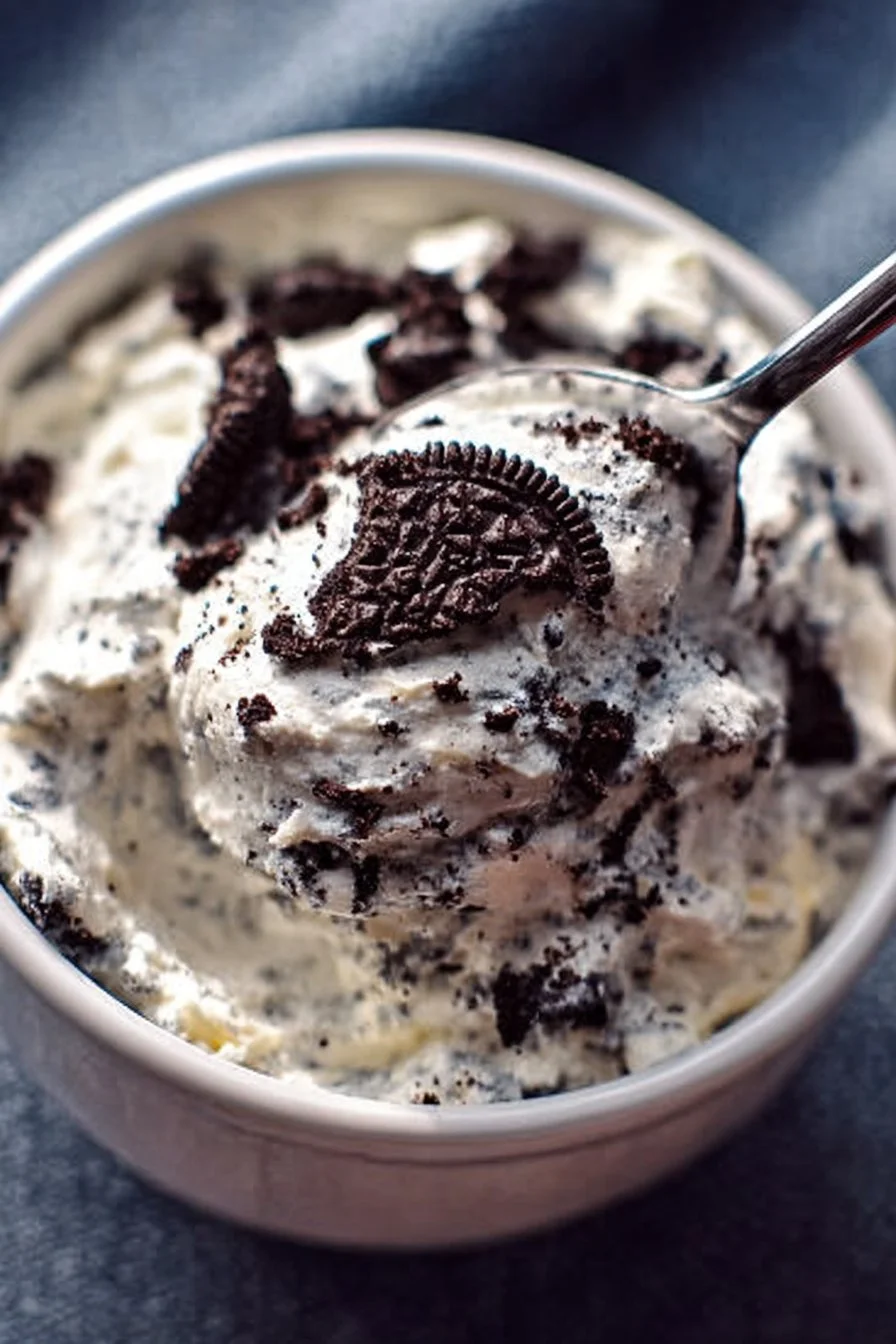 Weight Watcher Friendly Oreo Fluff dessert in a bowl topped with crushed Oreos.