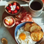 A beautifully arranged breakfast spread for mom, featuring fresh fruits and pastries.