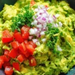 Bowl of authentic guacamole made with fresh avocados and spices