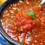 Fresh blender salsa made with tomatoes, onions, and cilantro.