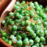 A vibrant cold green pea salad with fresh vegetables in a bowl.