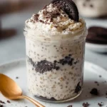 Delicious cookies and cream overnight oats served in a glass jar