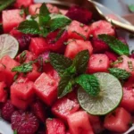 Keto watermelon salad with lime mint dressing in a bowl