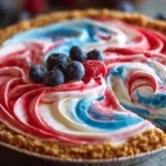 No-bake 4th of July swirl pie with colorful layers and whipped cream topping