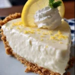 Delicious no-bake lemon icebox pie garnished with lemon slices and whipped cream