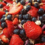 Fresh Strawberry Blueberry Salad with leafy greens and a light dressing