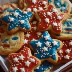 Festively decorated 4th of July cookies with red, white, and blue frosting