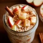 Bowl of Apple Cinnamon Overnight Oats topped with apples and cinnamon