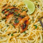 Cilantro-Lime Chicken Pasta garnished with fresh cilantro and lime slices