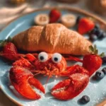 Crab Croissant with strawberry, banana, and blueberry toppings for a delightful treat.