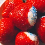 Delicious easy dessert strawberries topped with creamy frosting