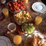 Delicious Father's Day brunch spread featuring pancakes, fruits, and coffee.
